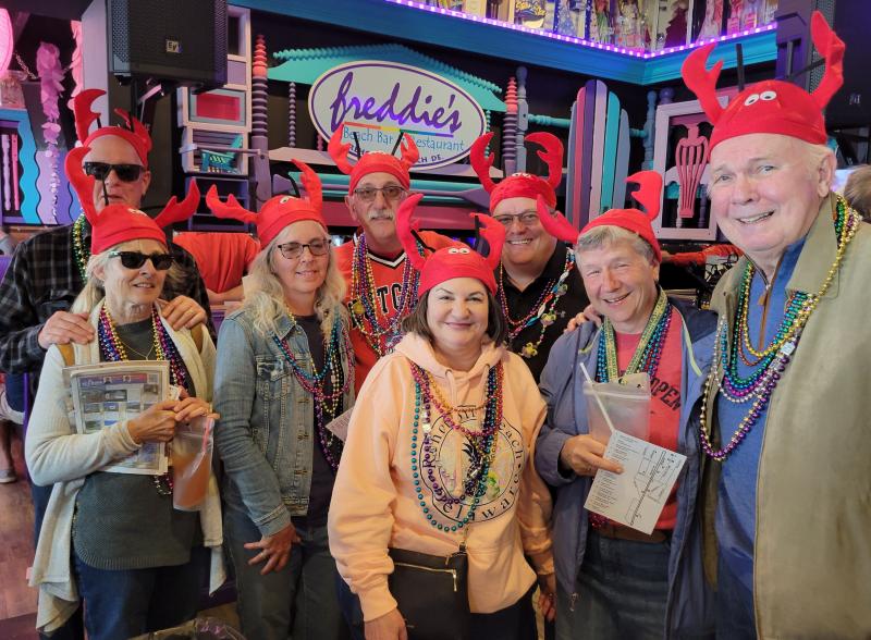 Rehoboth Beach Main Street and the Purple Parrot hosted the annual Gumbo Crawl April 30. There were a lot of beads worn by the participants, but not many had hats like this crew. Pictured are (l-r) Tim Cox, Barb Cox, Linda Walter, Rich Walter, Toni Ann Hawk, Michael Sevast, Sue Stringfield and Bill Hawk. CHRIS FLOOD PHOTOS